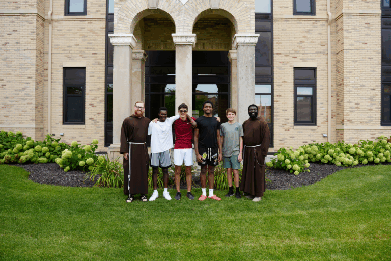 Monks and Seminarians standing outside St Joes